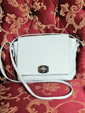 Furla Appaloosa Pebbled Leather Crossbody Bag in a light ice-blue color.